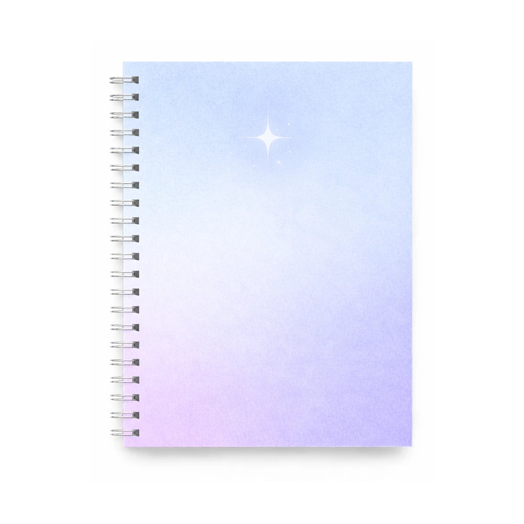 spiralblock i blå och lila toner/gradient med silver stjärna i minimalistisk design.