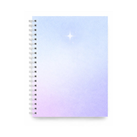 spiralblock i blå och lila toner/gradient med silver stjärna i minimalistisk design.